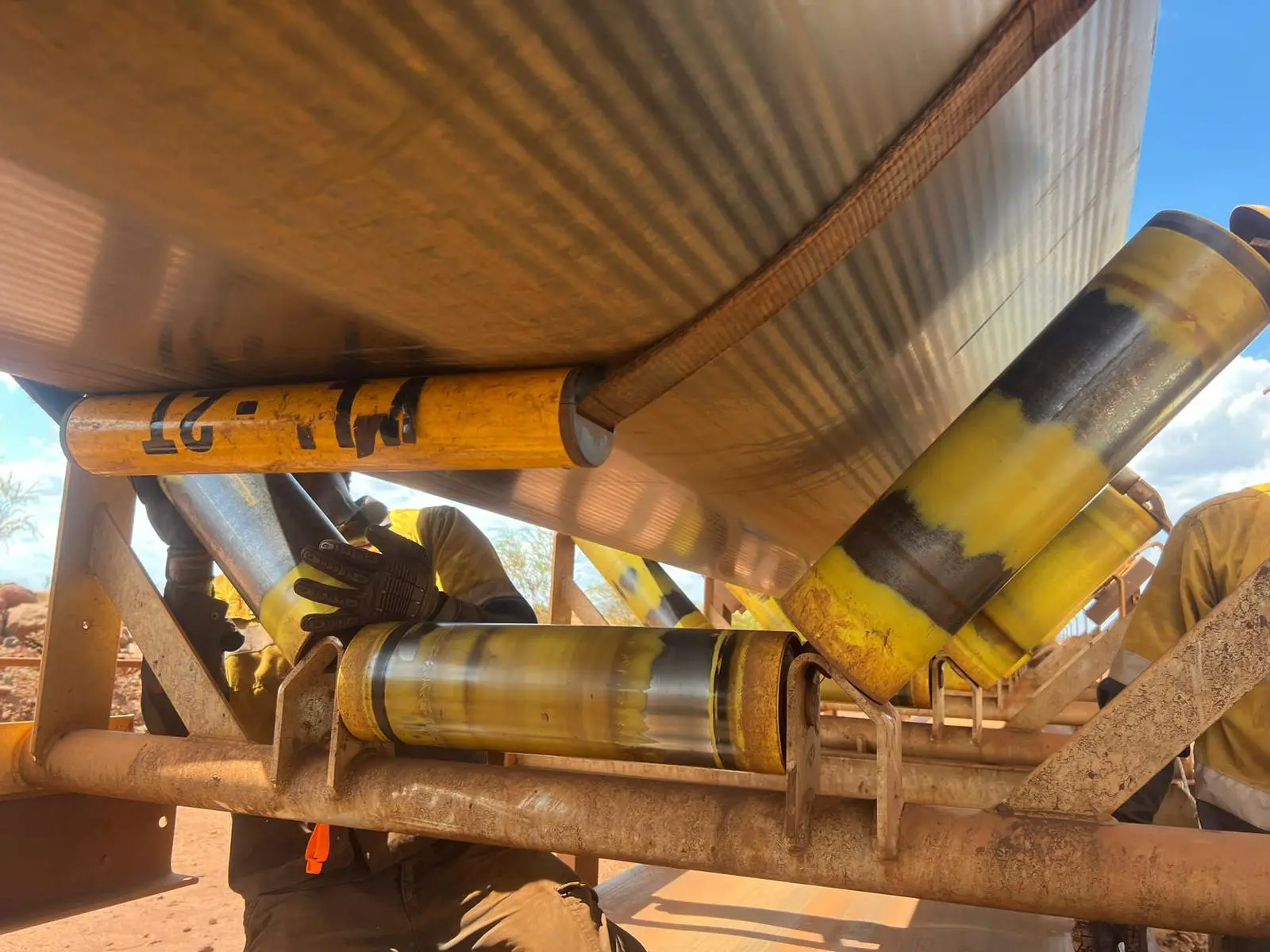 Techmine Sling Lifter in place on conveyor